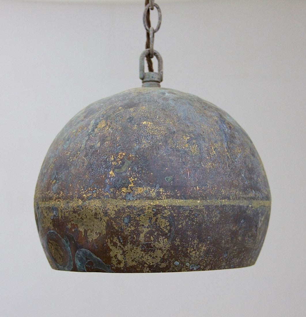 A set of three copper pendant lights
