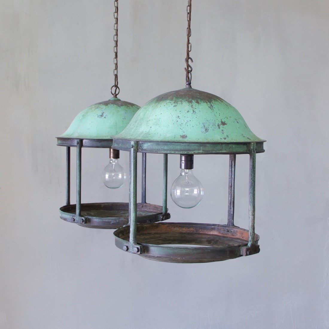 A pair of large copper rotunda lanterns with original verdigris patina