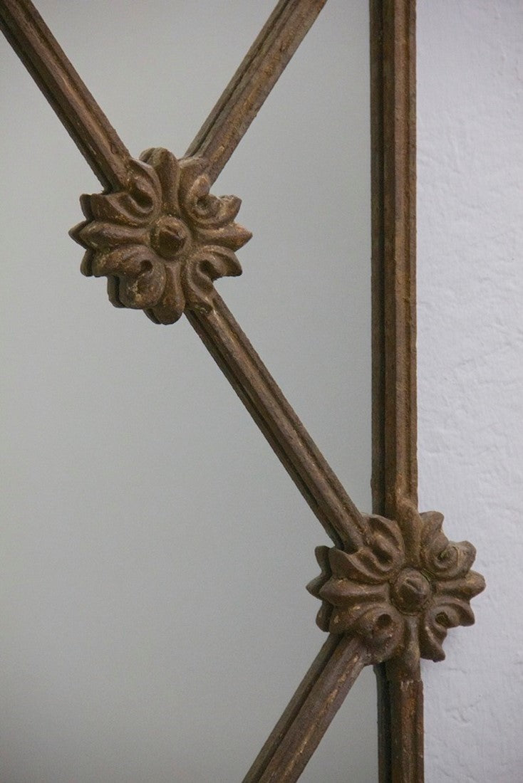 A C19th iron framed mirror.