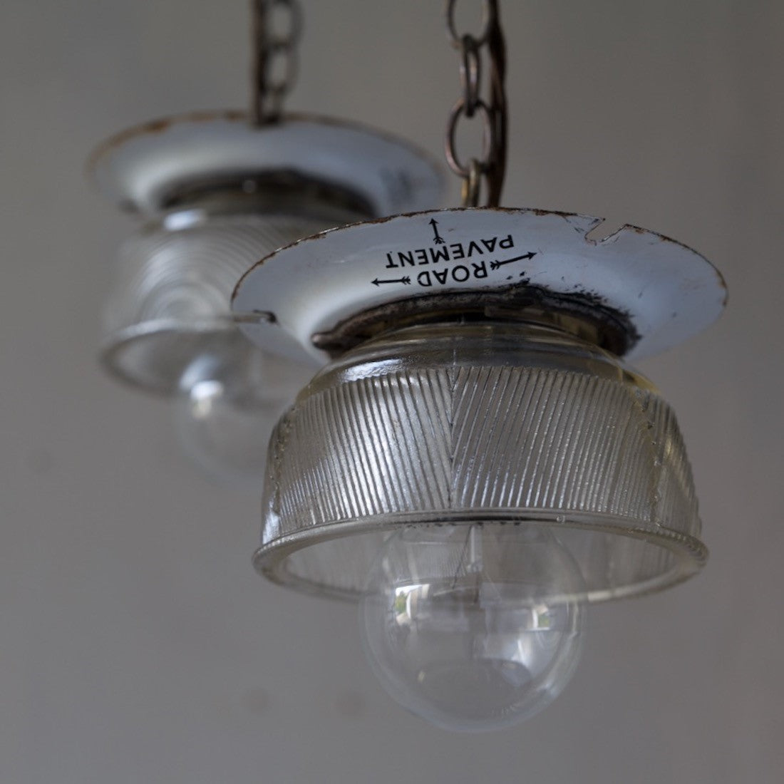 A pair of small glass pendant lights