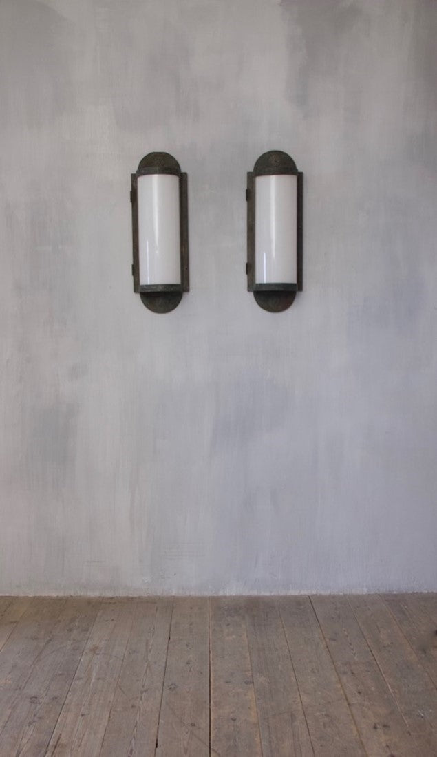 A pair of large bronze wall lanterns