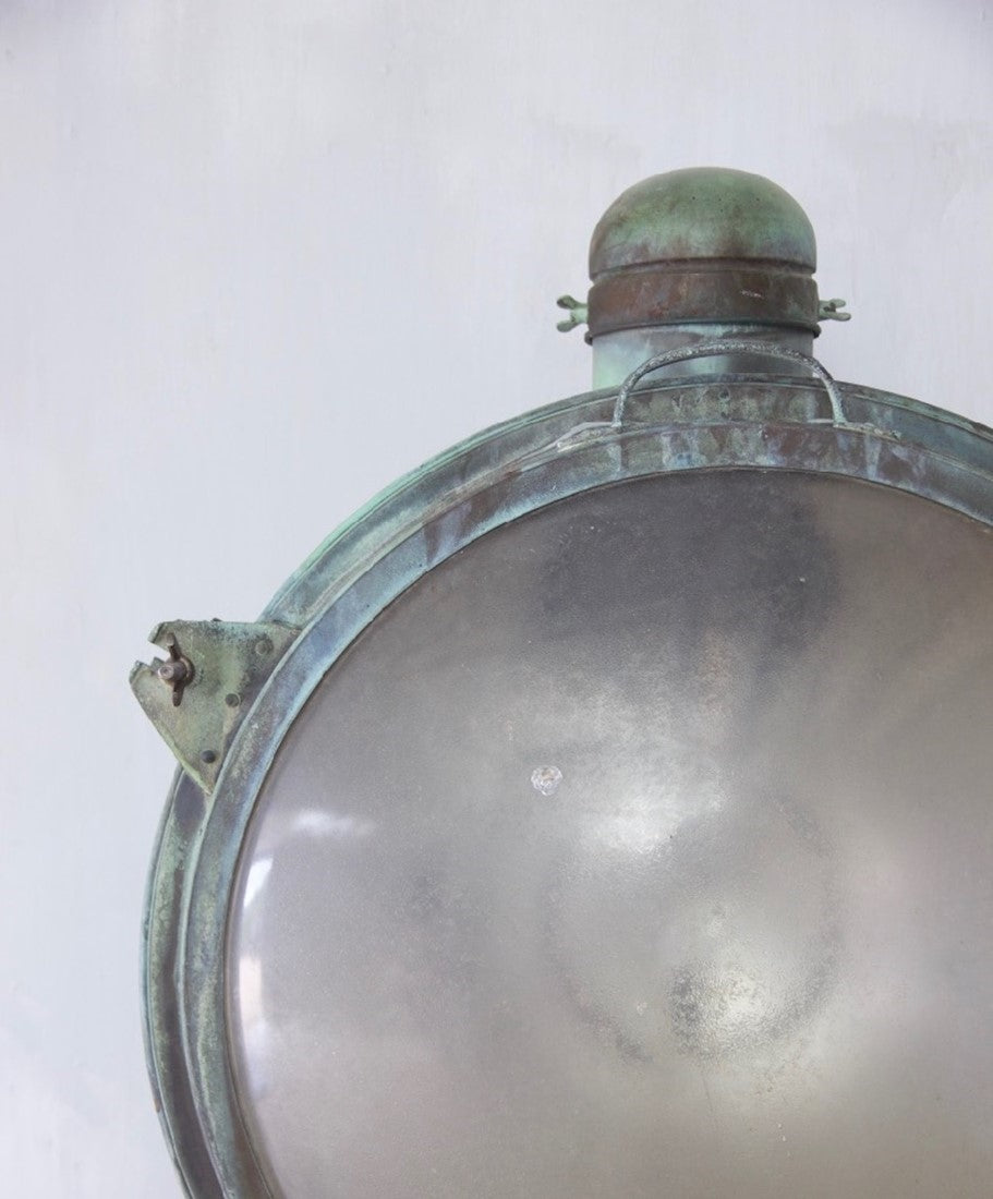 A 1920s pair of copper Holophane wall lights