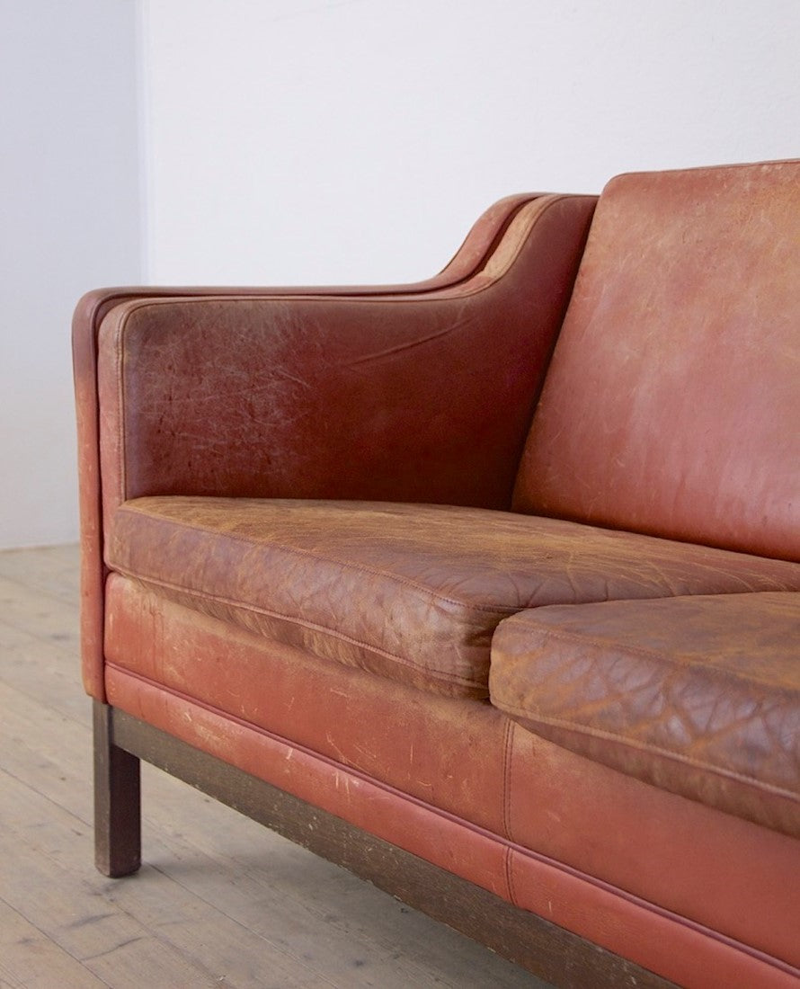 A mid 20th century leather sofa