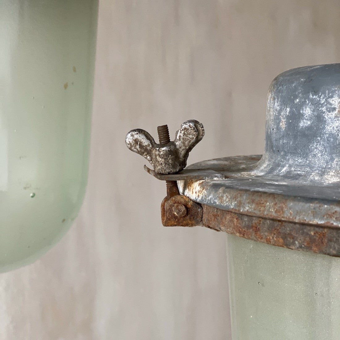 A pair of large industrial pendant lights