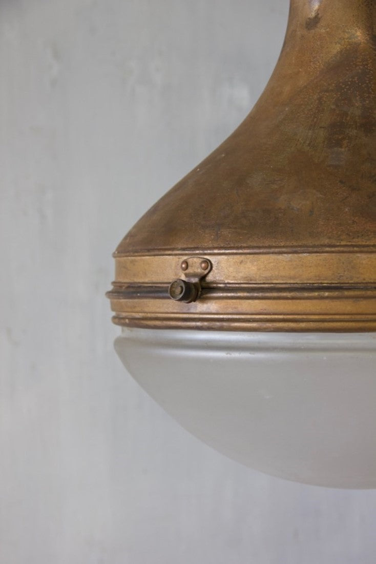 A spun copper pendant light