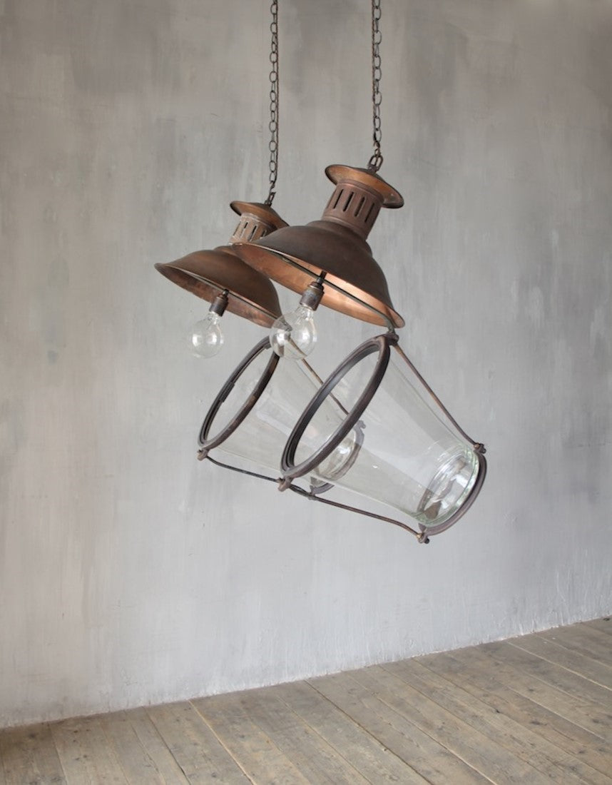A pair of cylindrical copper lanterns
