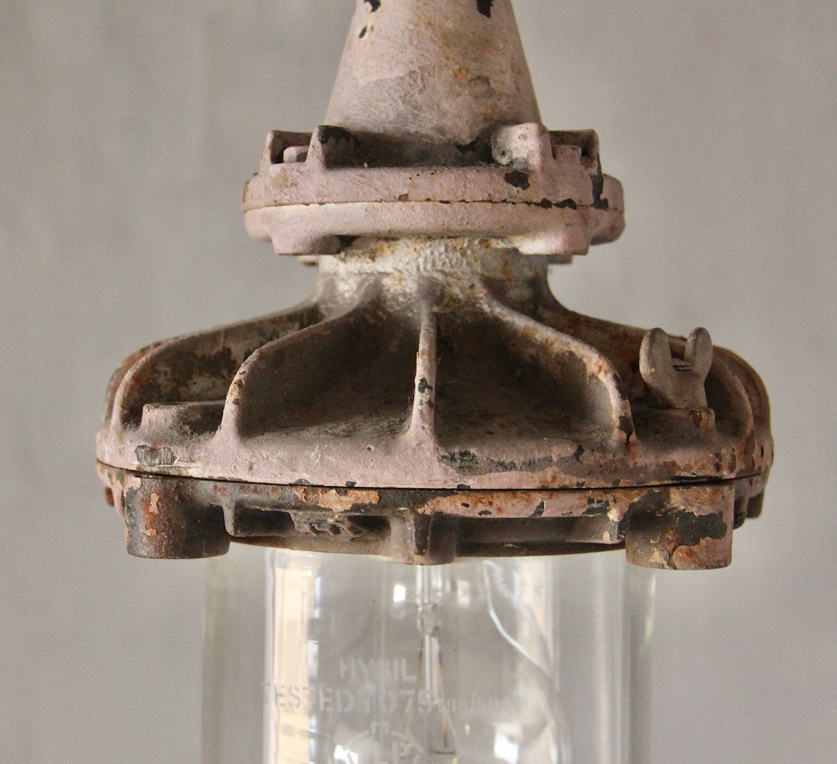 A set of three small industrial pendant lights