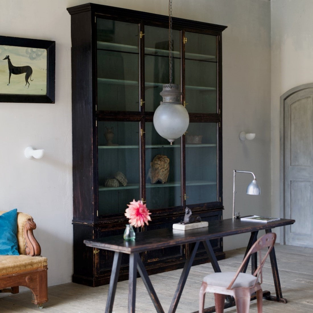 A large glass globe pendant light