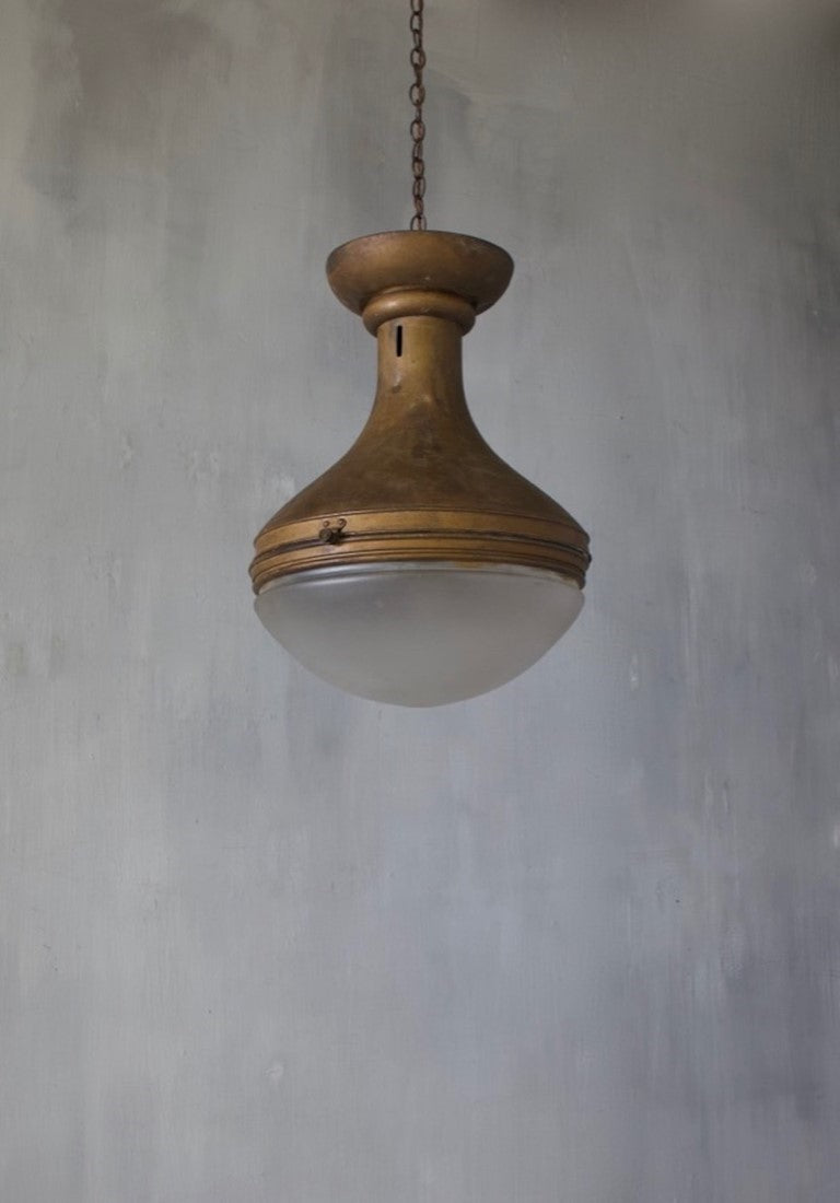 A spun copper pendant light