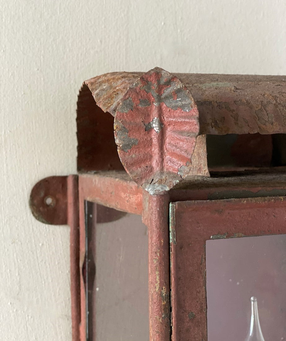 A primitive tole wall lantern