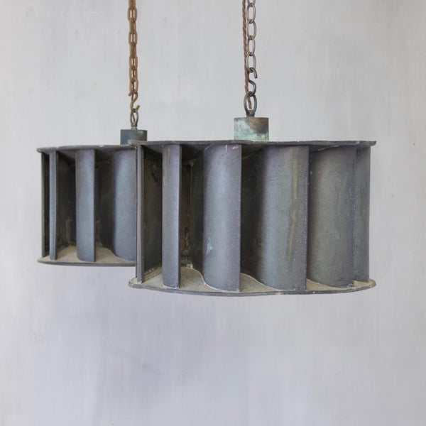 A pair of industrial copper pendant lights