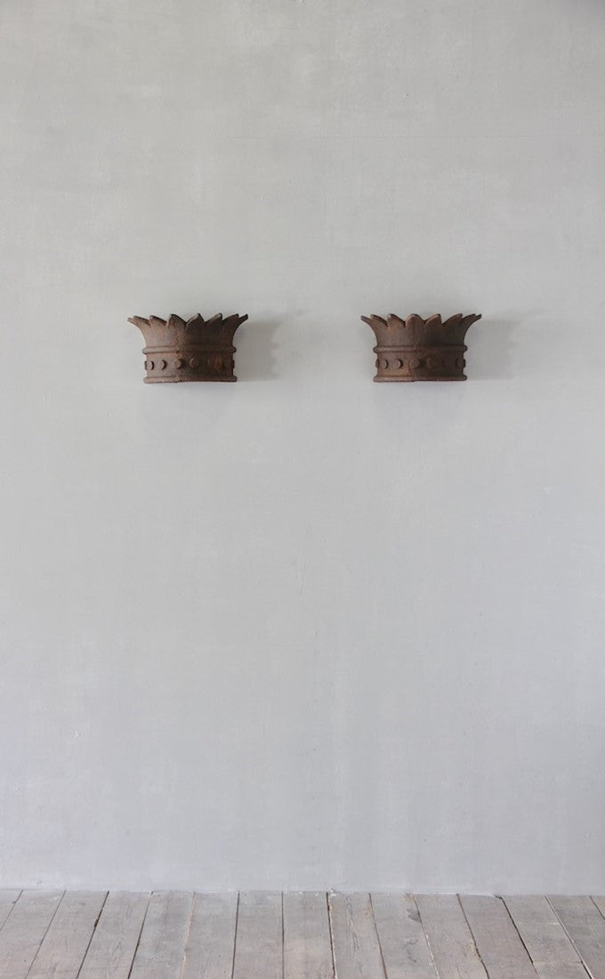 A pair of crown wall lights
