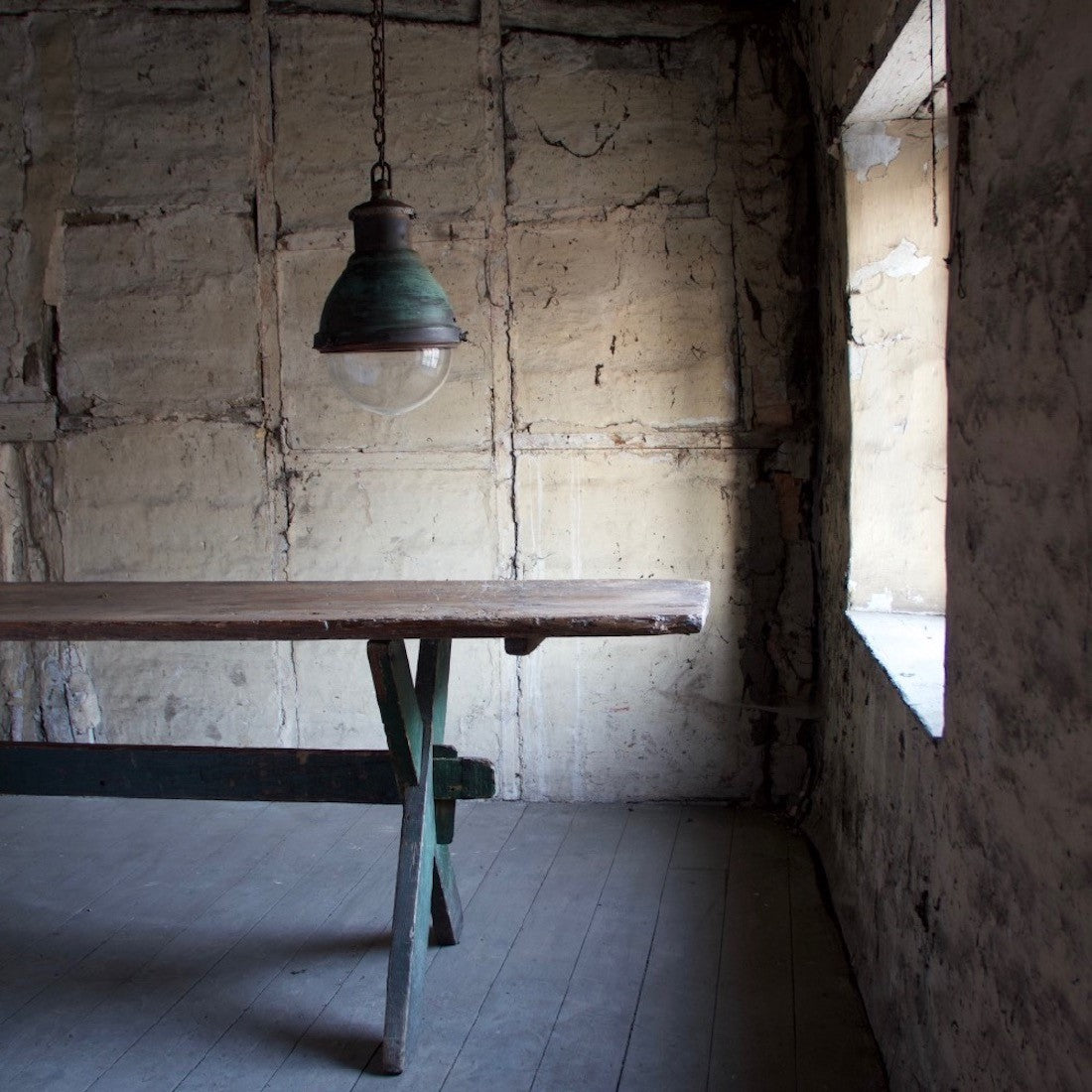 An industrial copper pendant light