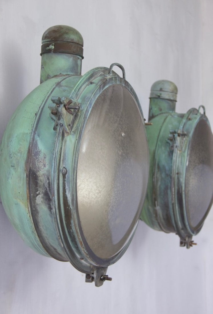 A 1920s pair of copper Holophane wall lights