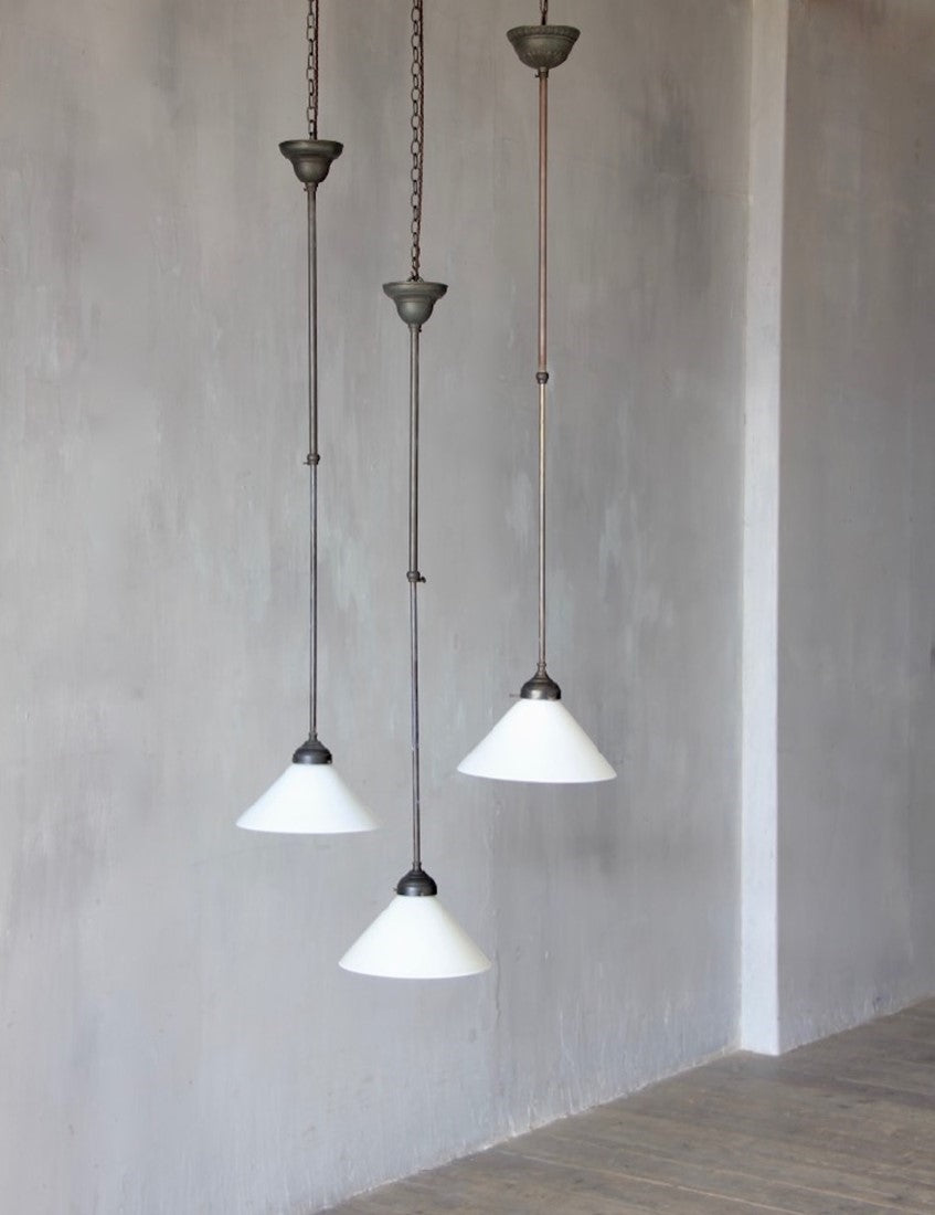A set of 3 adjustable milk glass pendant lights