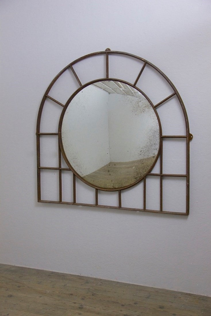 A large C19th wrought iron convex mirror