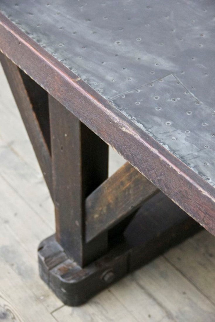 An architectural C19th work table with a patchwork zinc top
