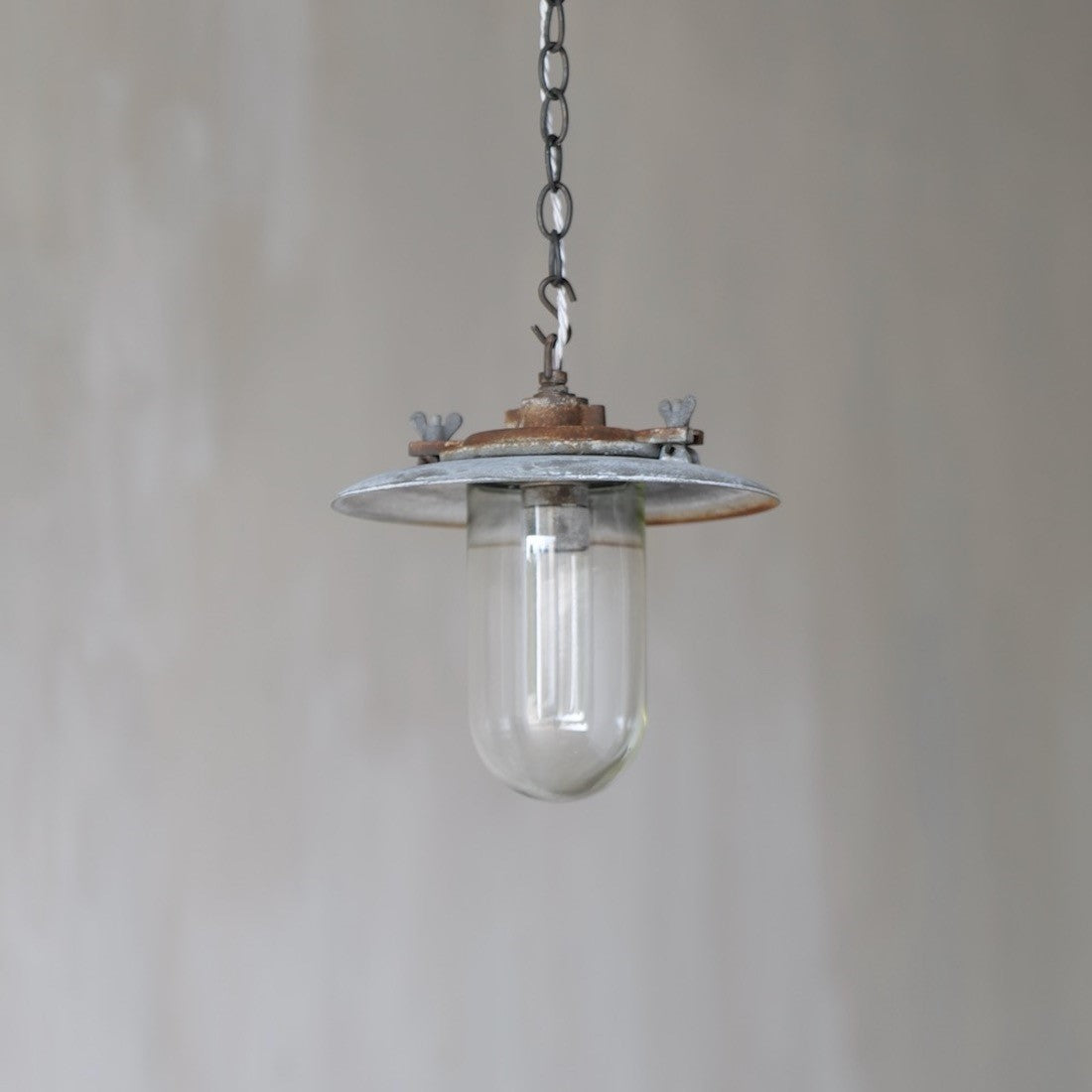 A 1930s iron pendant light