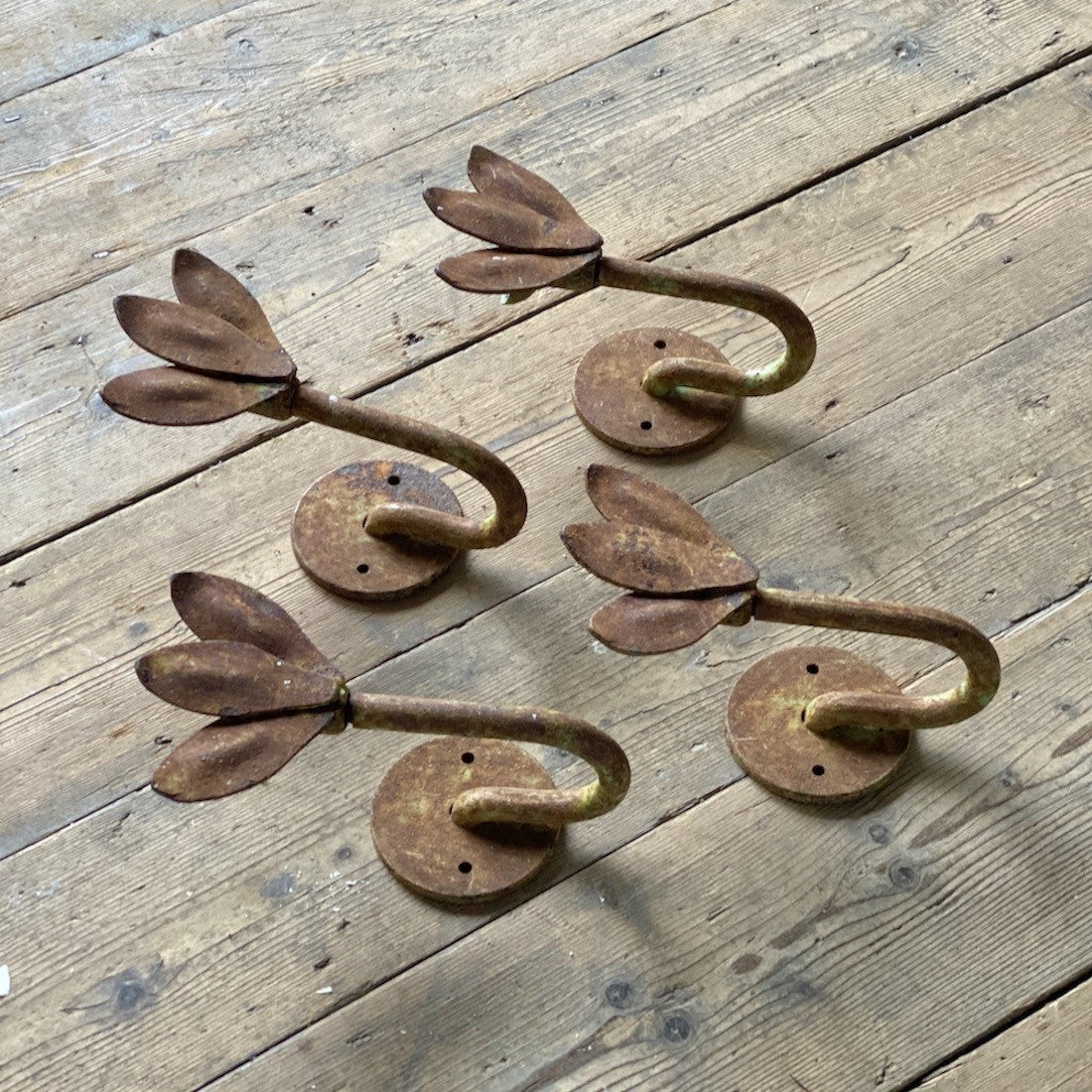 A set of four petal sconces