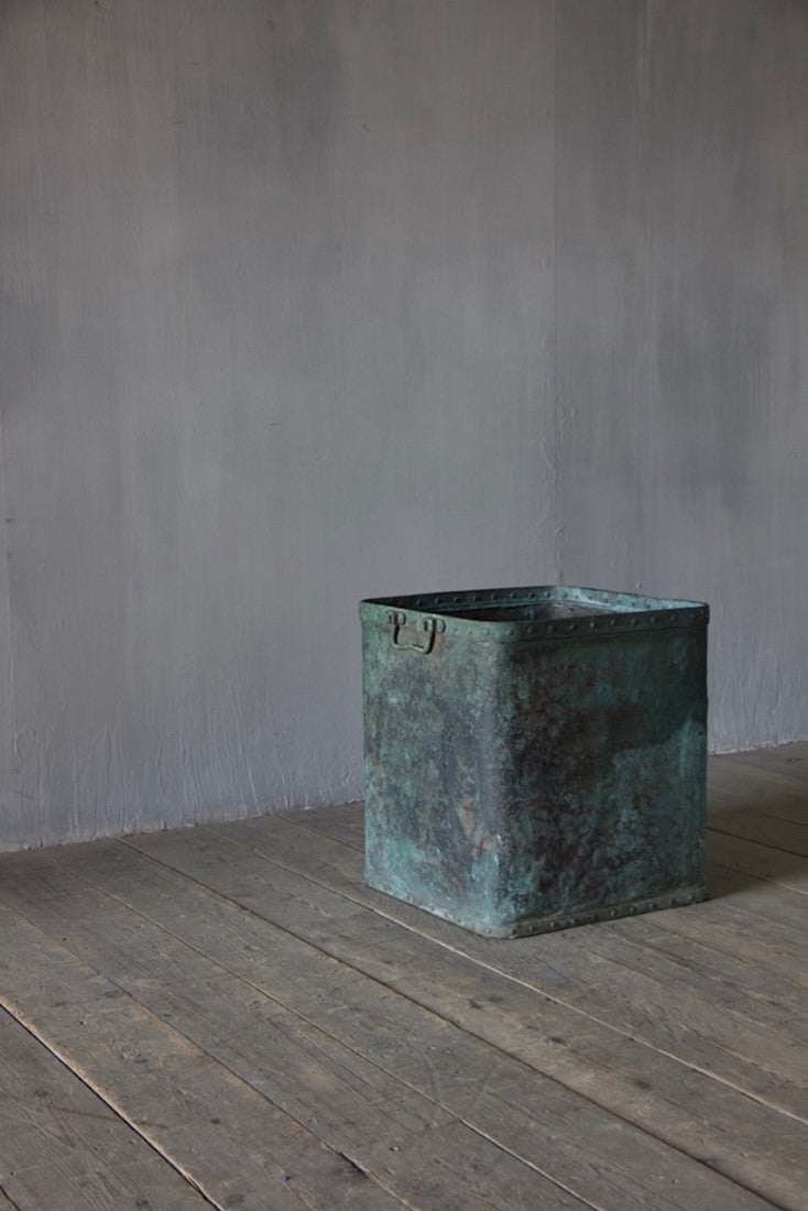 A verdigris copper tub