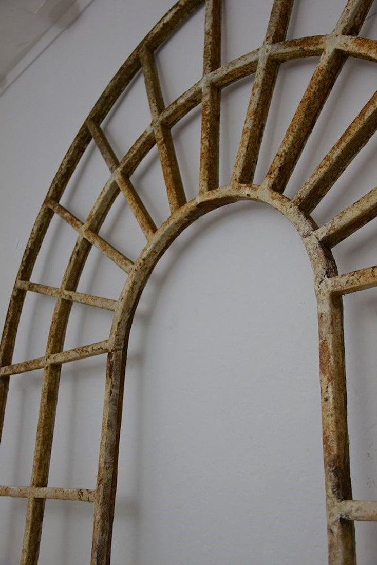 A large pair of C19th arched iron frames
