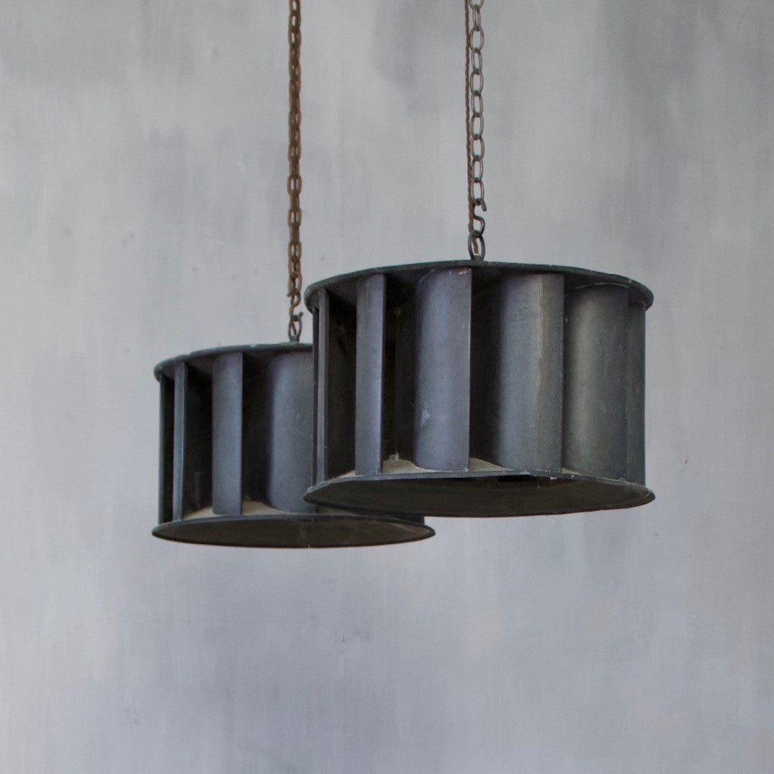 A pair of industrial copper pendant lights