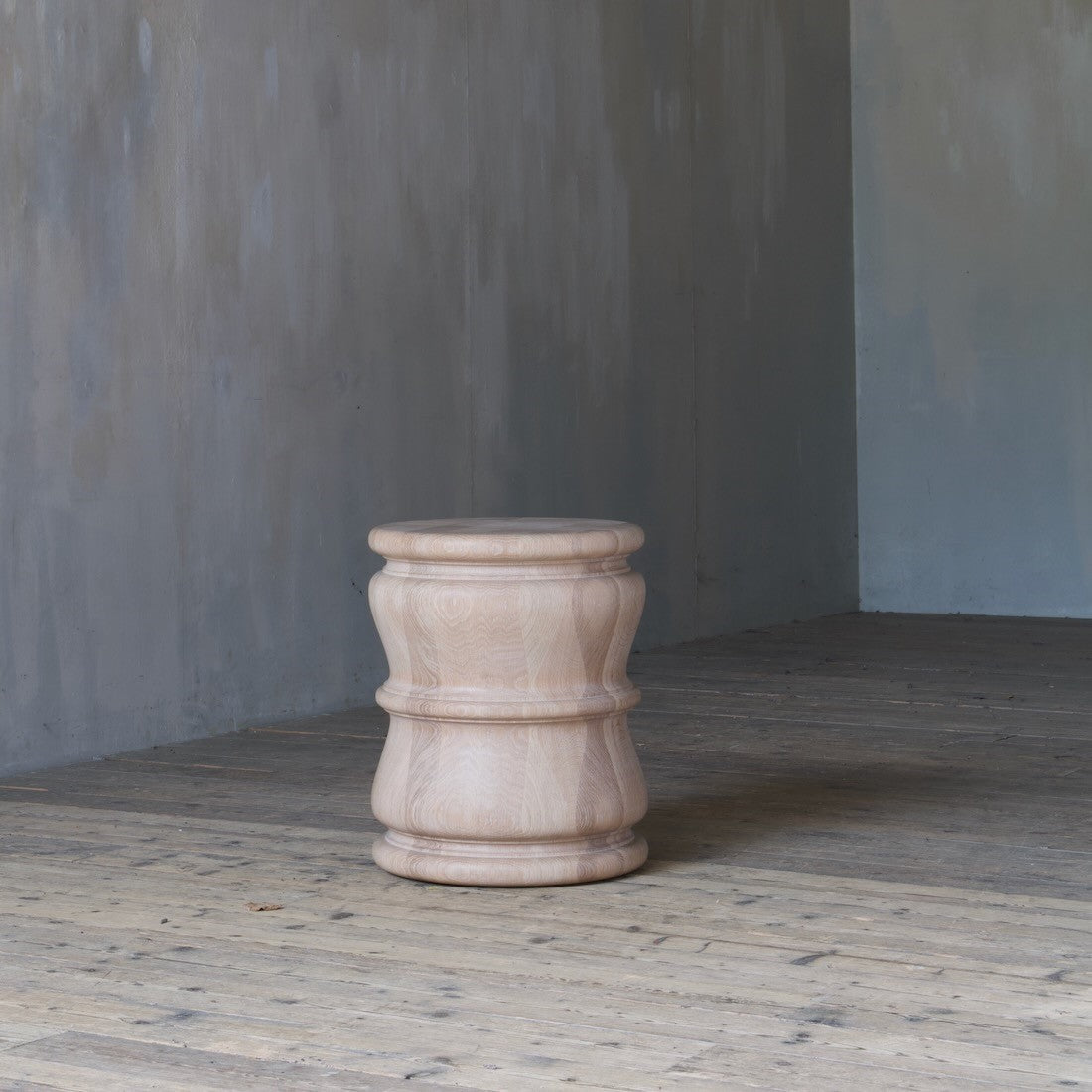 A pair of bespoke turned side tables