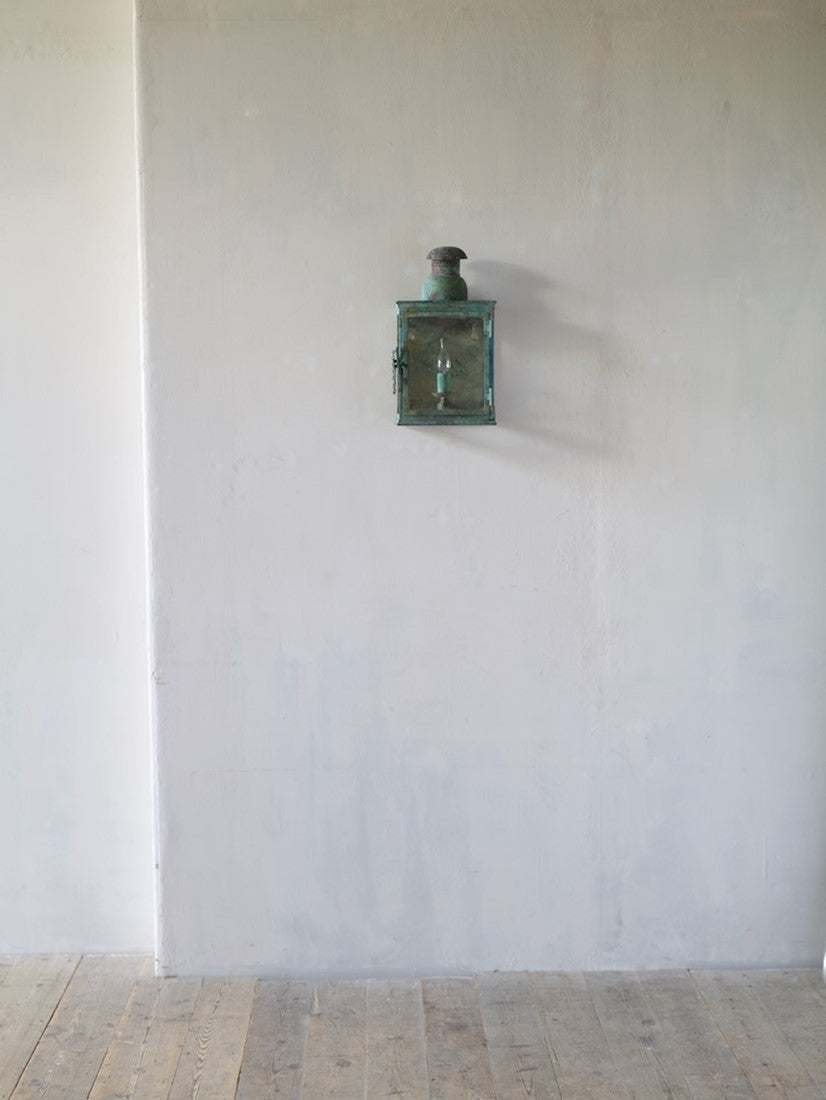 A verdigris bronze wall lantern