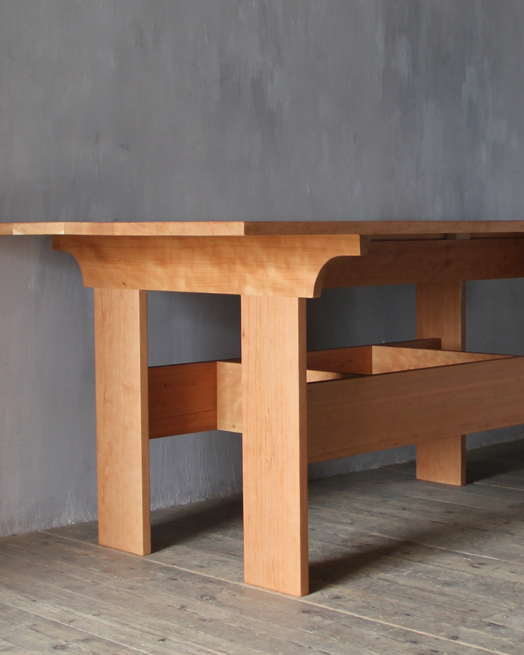 A Martello dining table in American black cherry