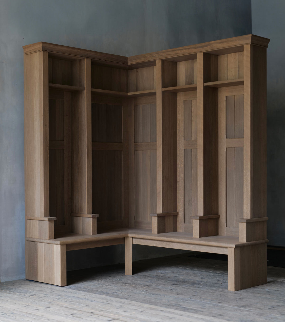 A large oak mudroom installation. Bespoke joinery in a worn fumed oak finish.