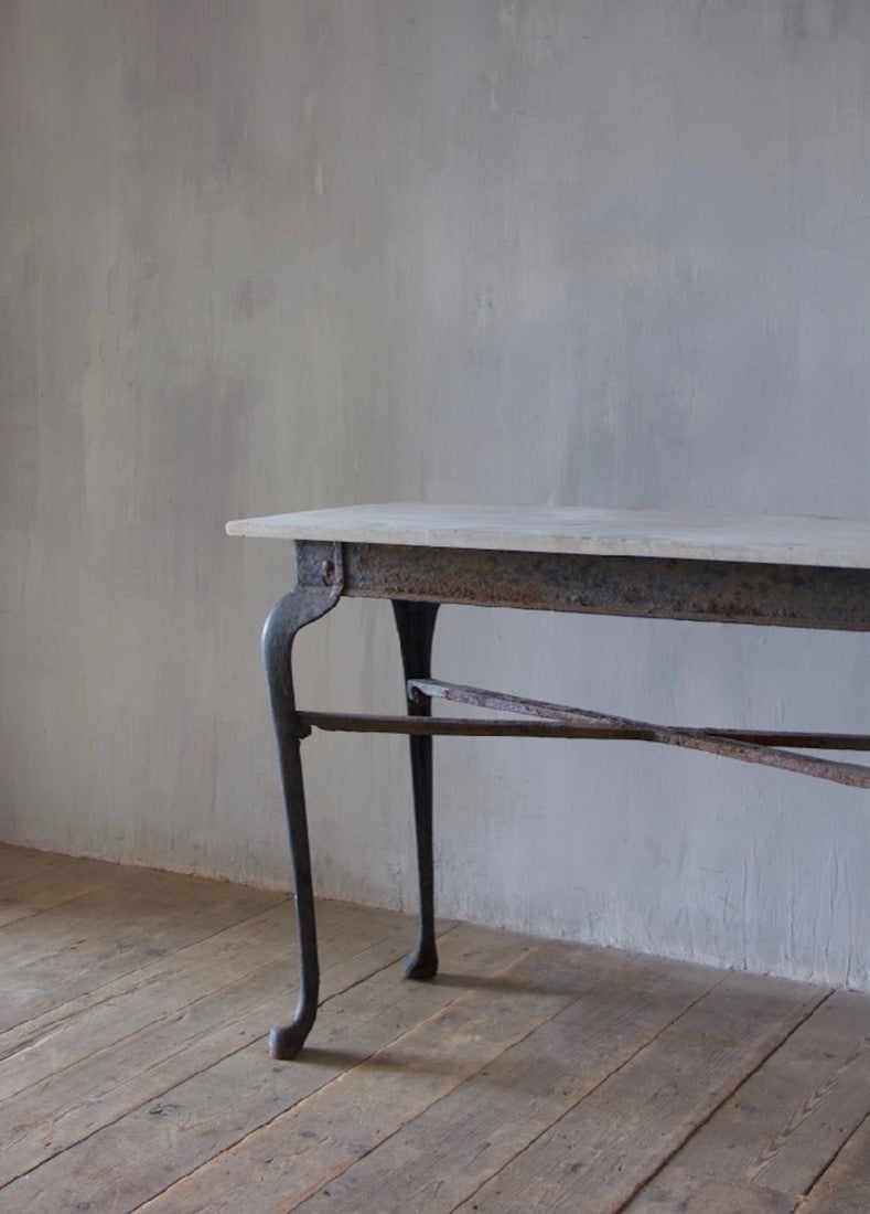 An iron and marble console table