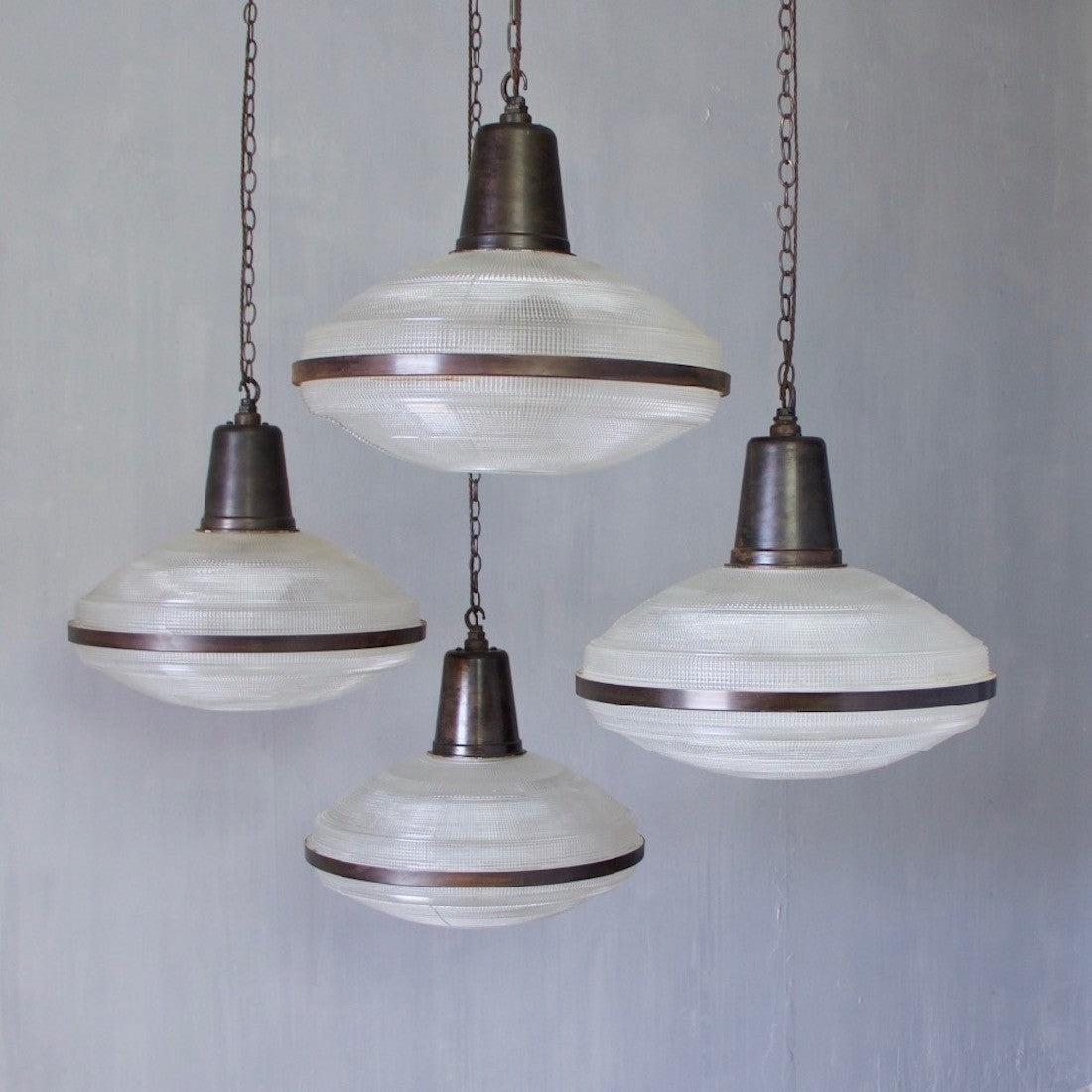 A set of 5 large Holophane pendant lights