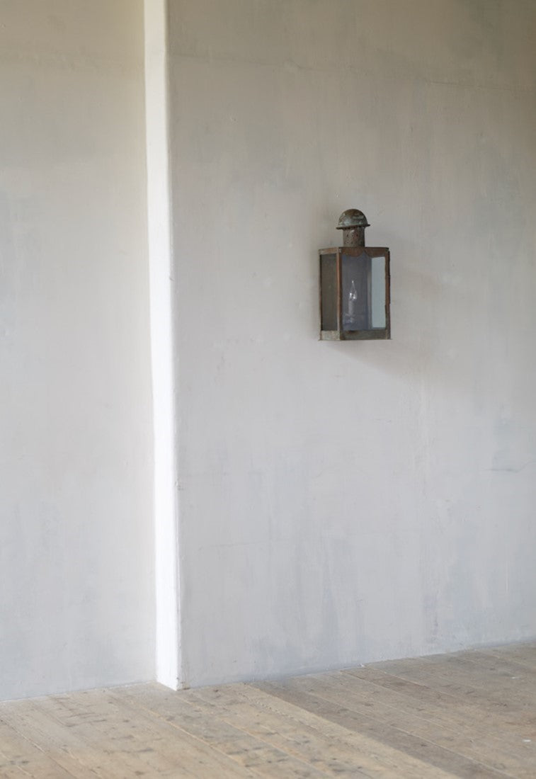 A primitive copper wall lantern