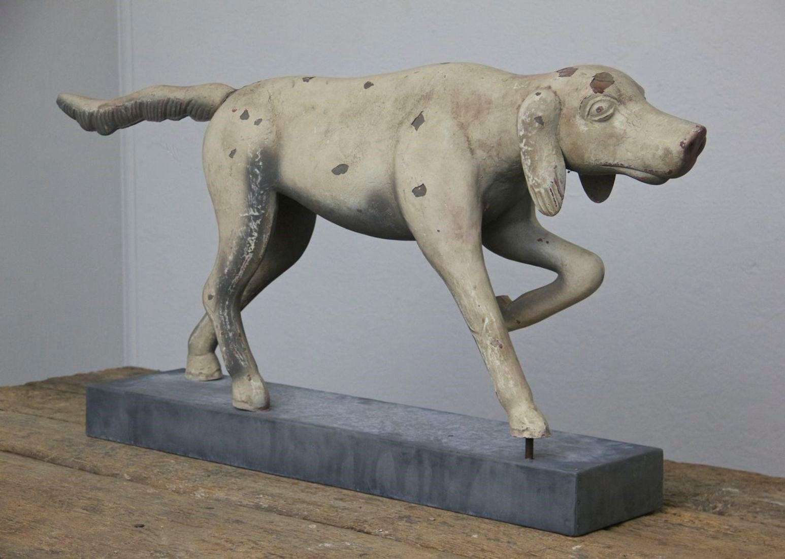 A primitive tin hunting dog