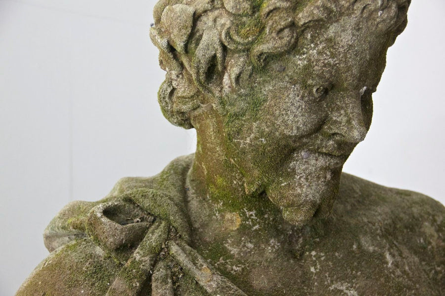 A weathered bust of Bacchus