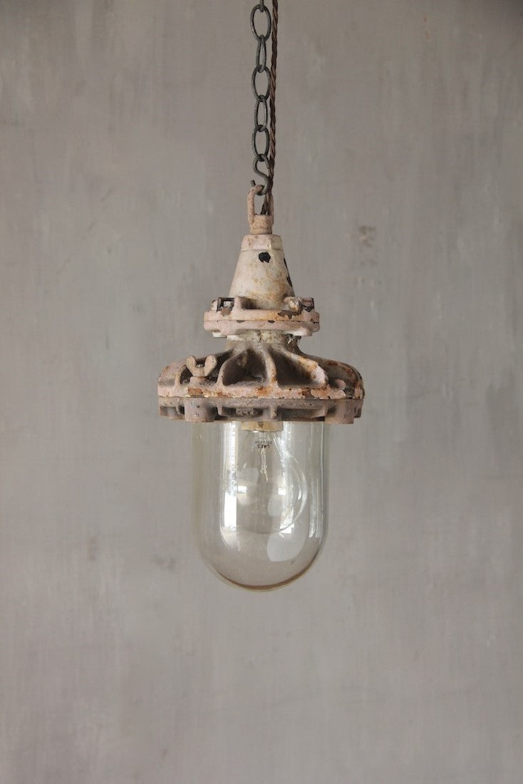 A set of three small industrial pendant lights