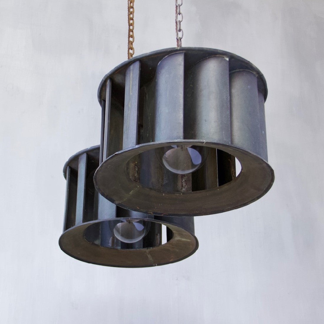 A pair of industrial copper pendant lights