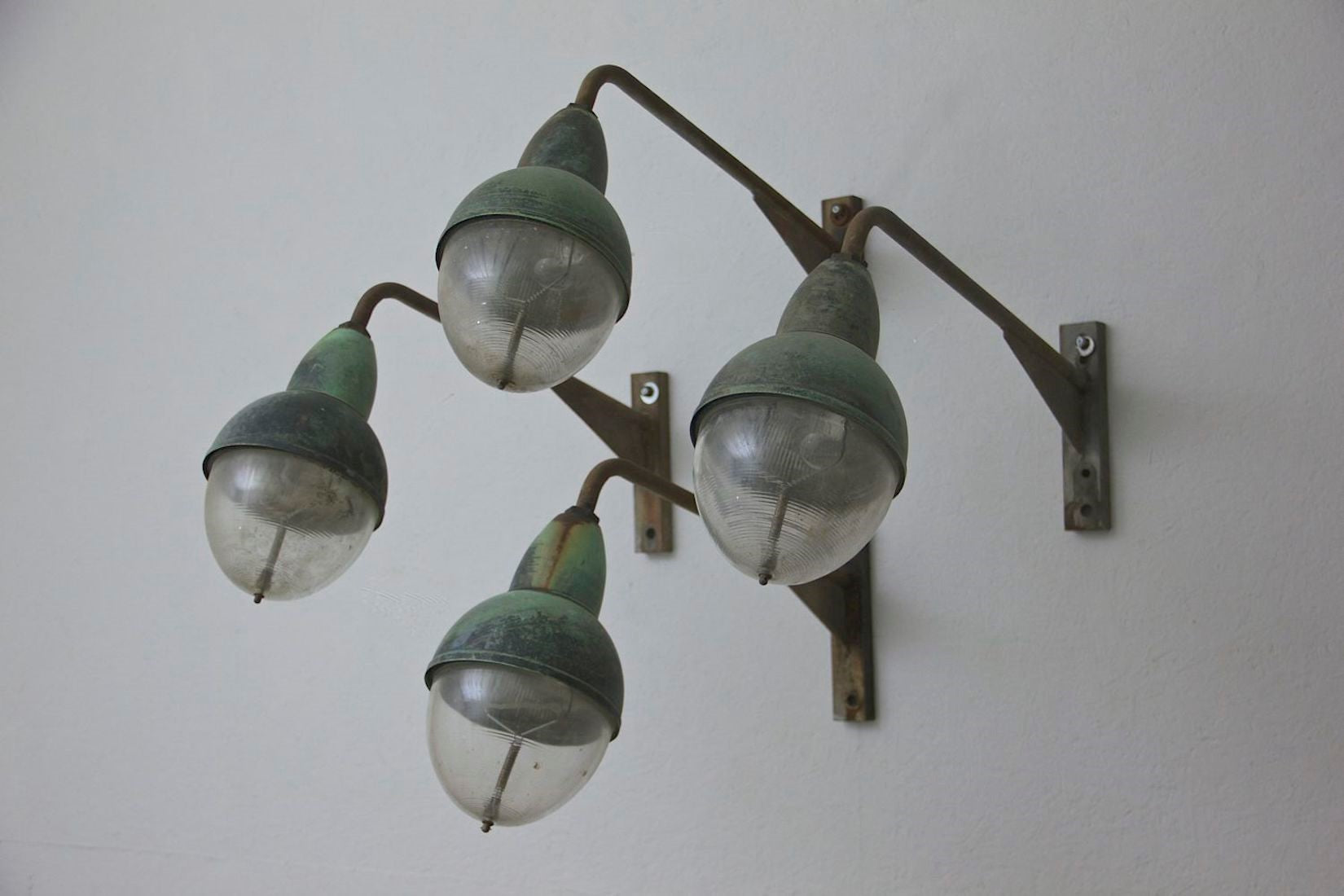 A run of 10 Holophane wall lights