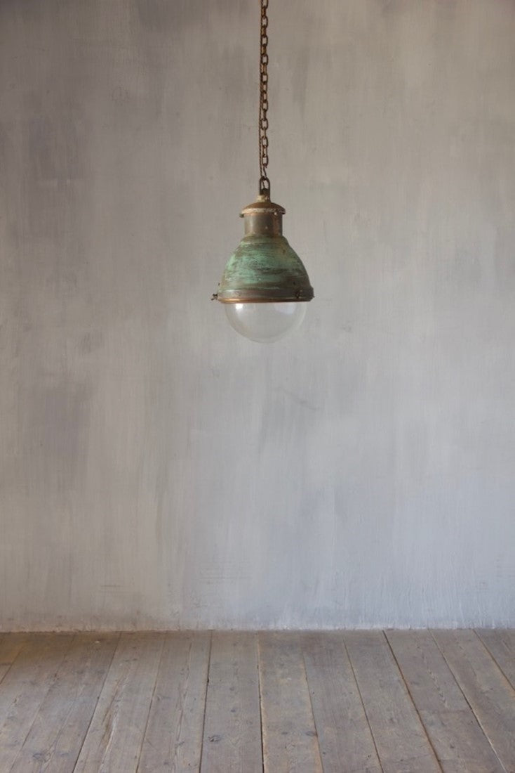 An industrial copper pendant light