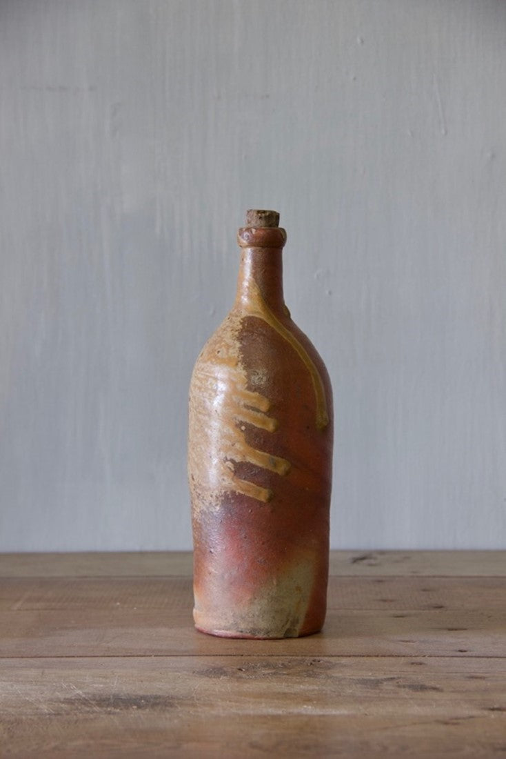 A set of ten clay bottles