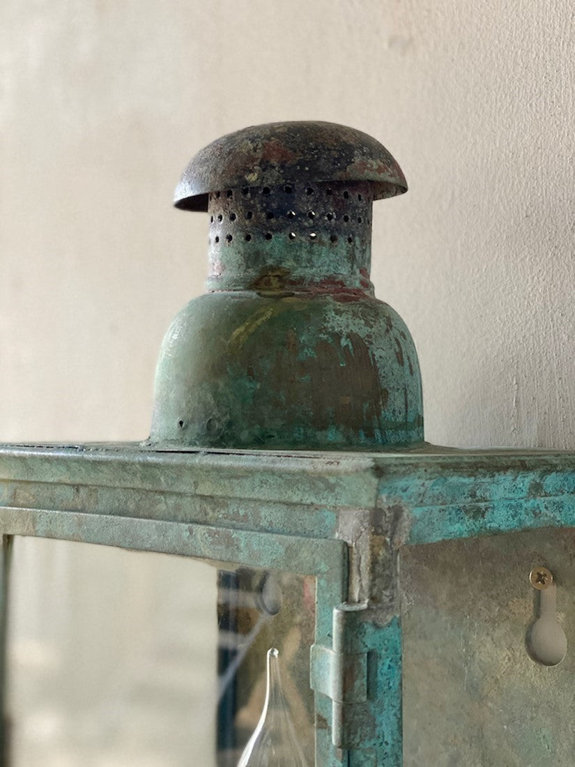 A verdigris bronze wall lantern