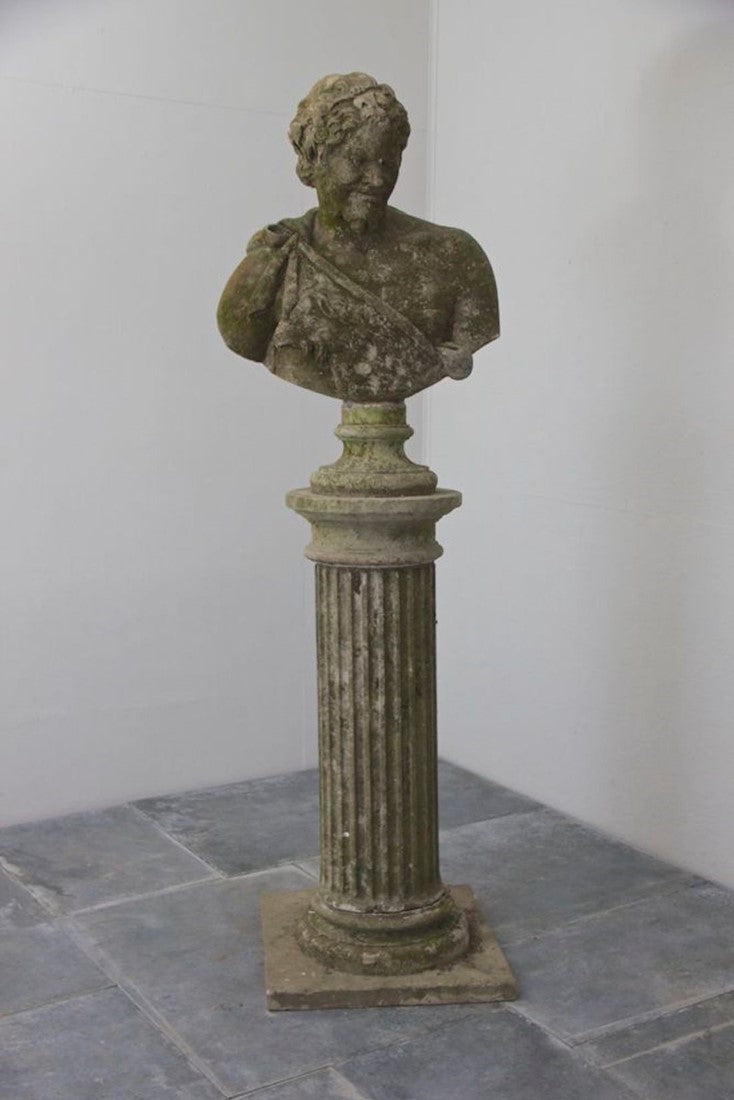 A weathered bust of Bacchus