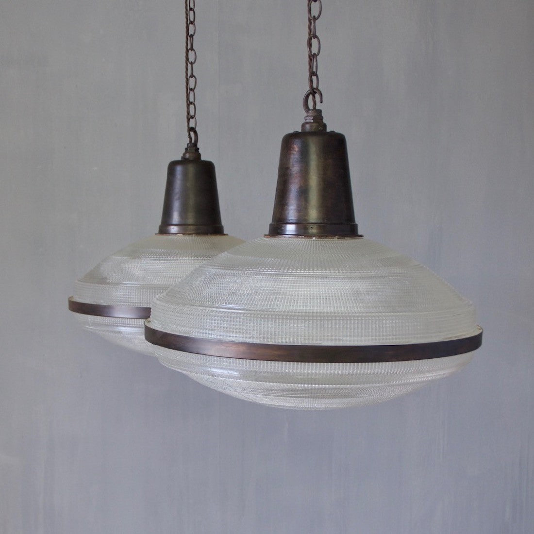 A set of 5 large Holophane pendant lights