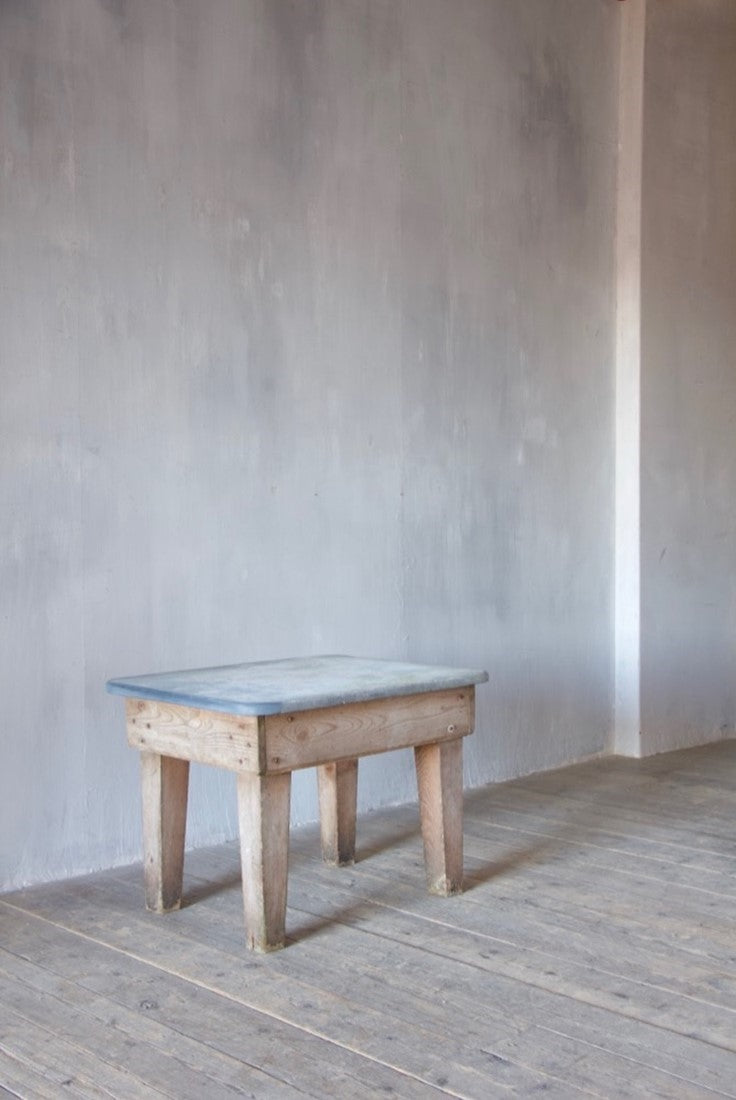A primitive estate-made side table
