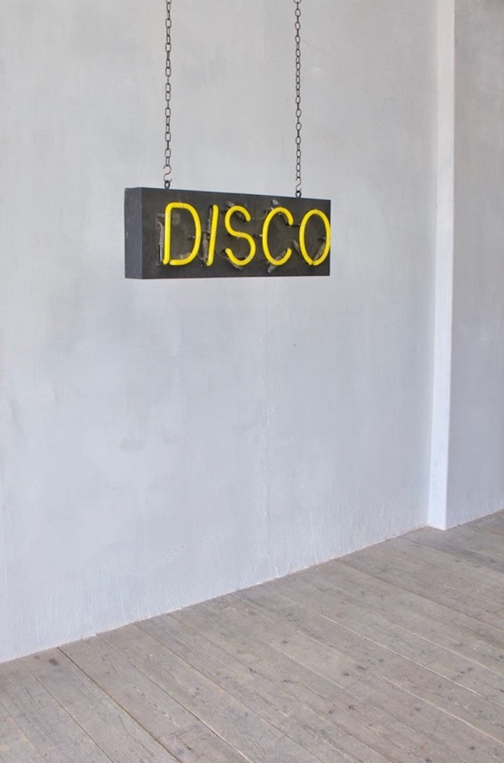 A 1980s neon disco sign