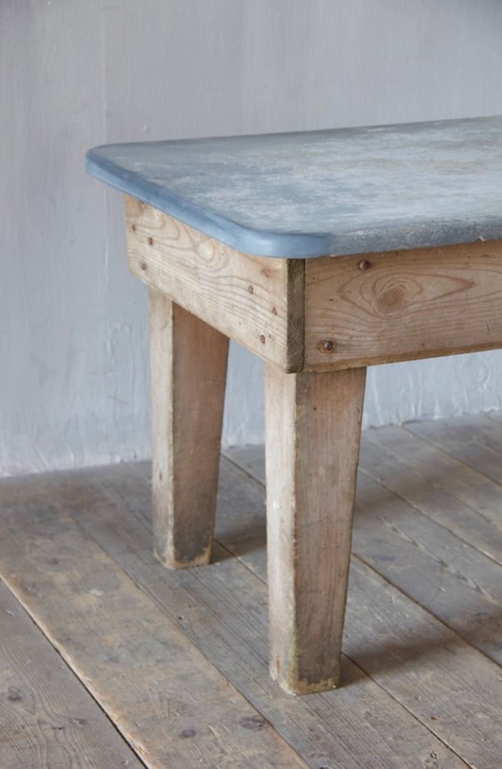 A primitive estate-made side table