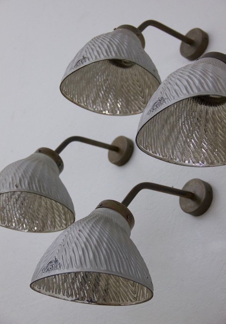 A set of 4 mirrored wall lights