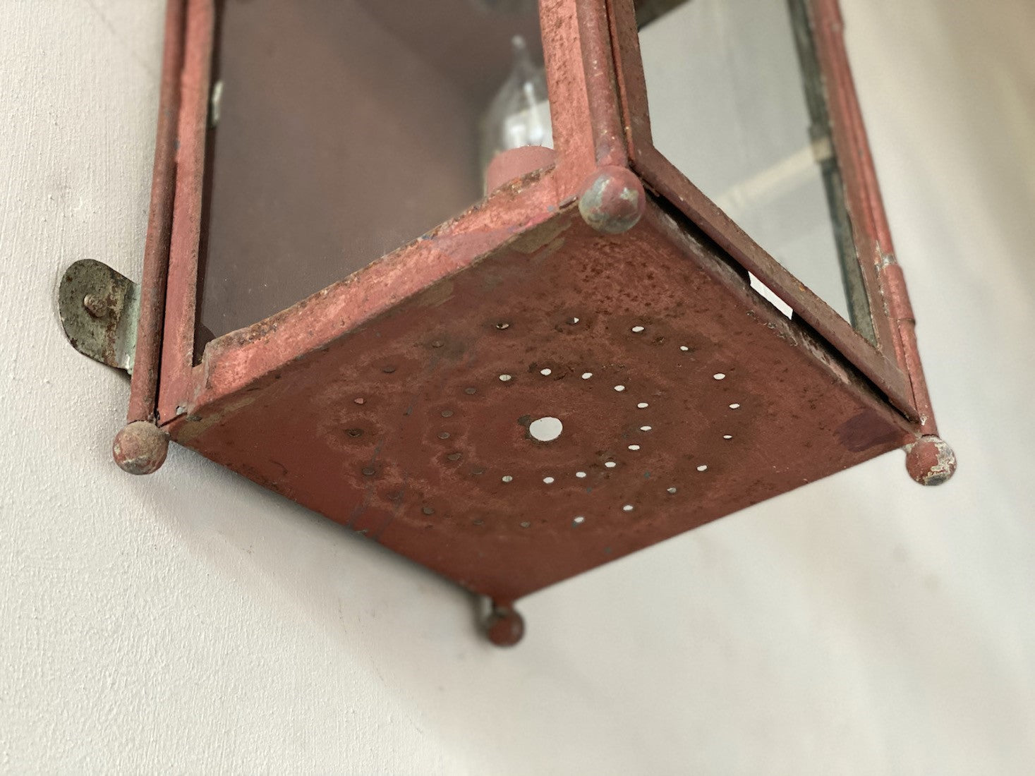 A primitive tole wall lantern