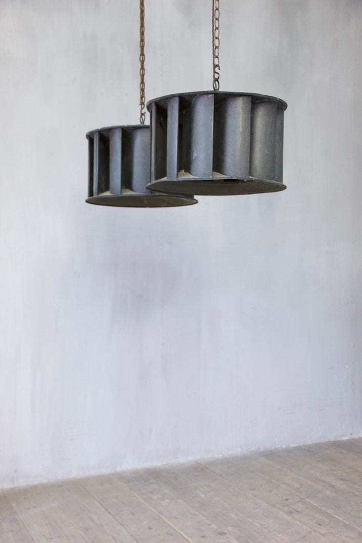 A pair of industrial copper pendant lights