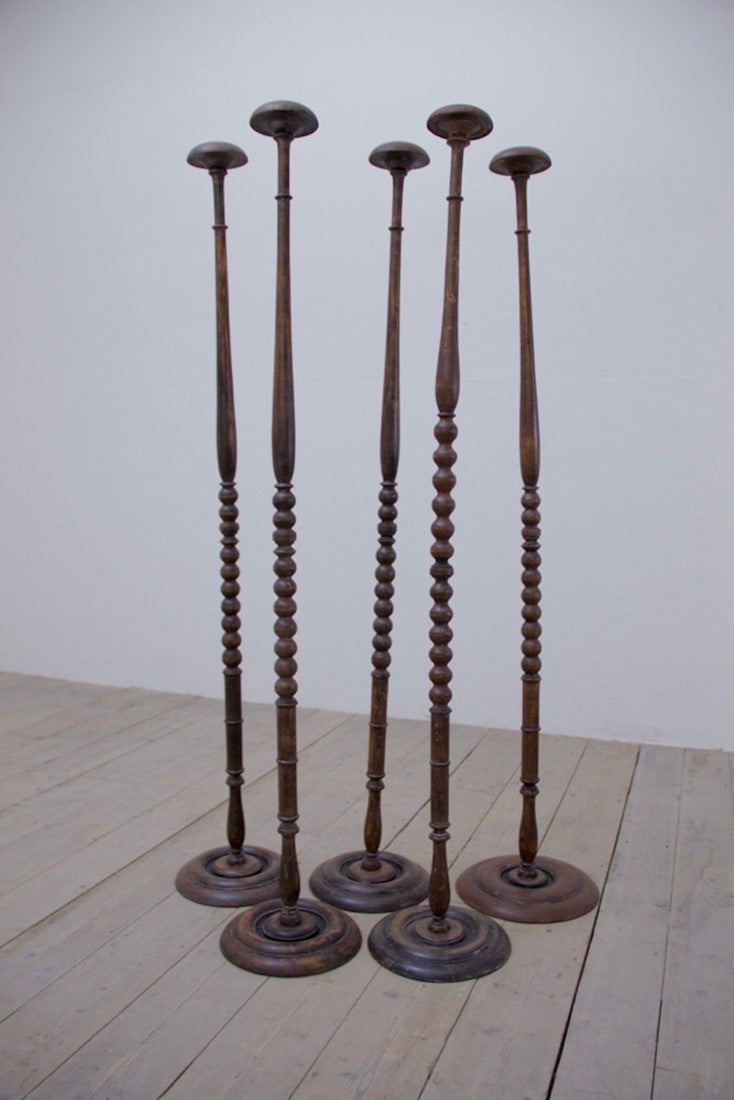 A collection of 5 ebonised hat stands
